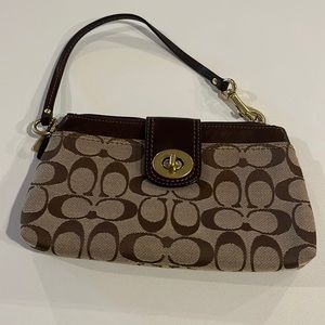 Coach Khaki wristlet. Pink lining.